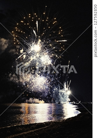 Beach Surrounded By Lights During Independence Day Party Fireworks At Night Beach Surrounded By Lights During Independence Day Party Fireworks At Night 127592850