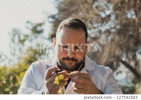 Herborist Picking Flower Petals In The Nature Herborist Picking Flower Petals In The Nature 127592883