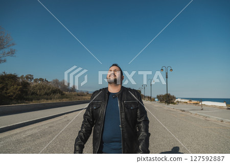 Man Happy To Have The Sun On His Face  127592887