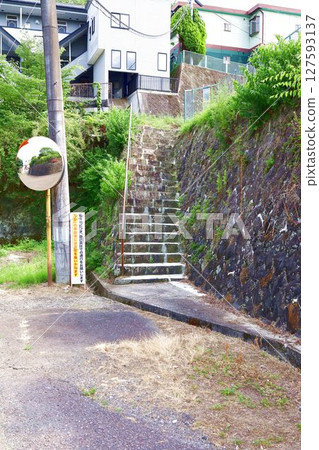 Old convex mirror, stone steps and stone wall Old convex mirror, stone steps and stone wall 127593137