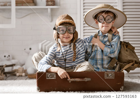 Boys in images traveler and pilot play in his room Boys in images traveler and pilot play in his room 127593163