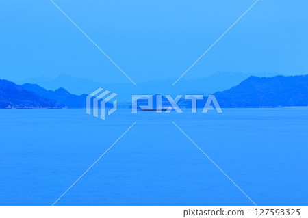 View of the Shikoku Mountains and Tobishima Kaido from Oshiba Island at dusk View of the Shikoku Mountains and Tobishima Kaido from Oshiba Island at dusk 127593325