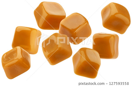 Flying caramel candies, toffee bonbons isolated on white background with clipping path Flying caramel candies, toffee bonbons isolated on white background with clipping path 127593558