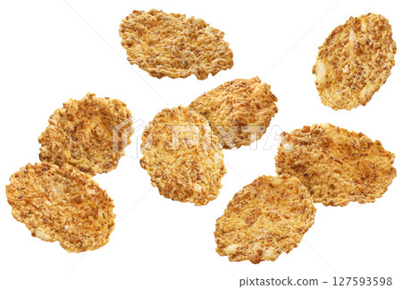 Flying wholegrain cereal flakes isolated on white background with clipping path 127593598
