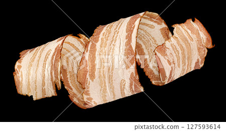 Bacon strip, pork brisket slice isolated on black background Bacon strip, pork brisket slice isolated on black background 127593614