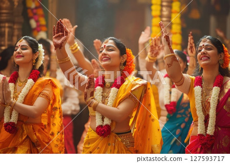 People celebrating the festival with joyful dance and heartfelt prayers to the divine, surrounded by vibrant colors and cultural rhythms 127593717