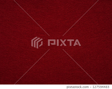 Embracing the allure of a sultry claret, this felt surface captivates with a tactile dance of shadow and depth 127594483