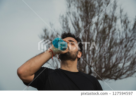 Athlete Refreshes With Water After A Hard Workout Athlete Refreshes With Water After A Hard Workout 127594597