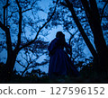 Night forest - woman praying 127596152