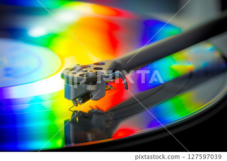 vinyl record with colorful lights reflection 127597039
