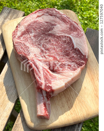 raw bio steak with bone 127597040