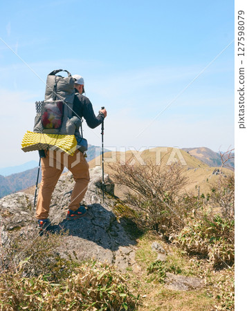 A man hiking in a tent 127598079