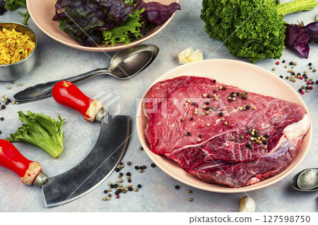 Piece of raw beef meat. 127598750