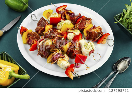 Raw meat skewers, fresh, ready-to-cook. Raw meat skewers, fresh, ready-to-cook. 127598751