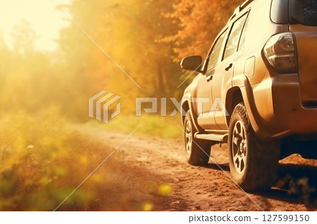 autumn off road with yellow leaves and a car, beautiful autumn nature 127599150