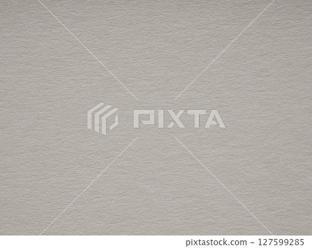 Subtle elegance in monochrome, this close-up showcases the nuanced textures of a grey paper background 127599285