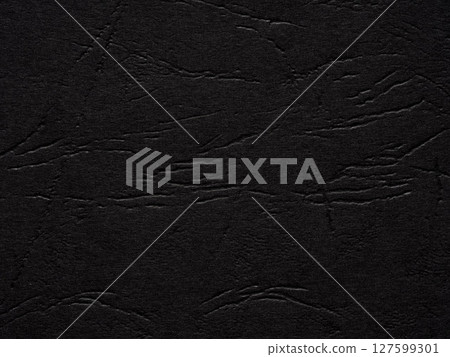 Rich darkness envelops the textured surface, hinting at the silent stories of the night 127599301