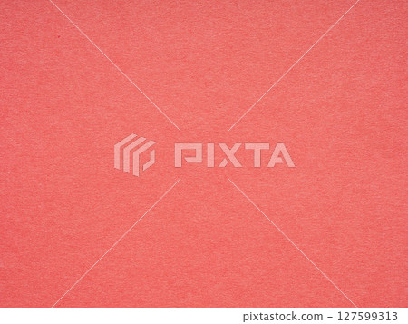 The textured coral surface of the paper exudes a serene warmth, inviting touch and inspiration The textured coral surface of the paper exudes a serene warmth, inviting touch and inspiration 127599313