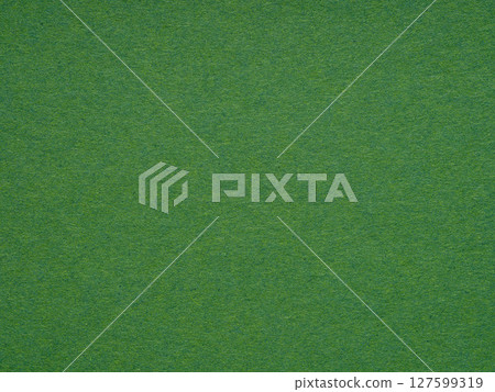 Emerald green paper surface reveals a fine fibrous texture, conjuring a sense of organic elegance Emerald green paper surface reveals a fine fibrous texture, conjuring a sense of organic elegance 127599319