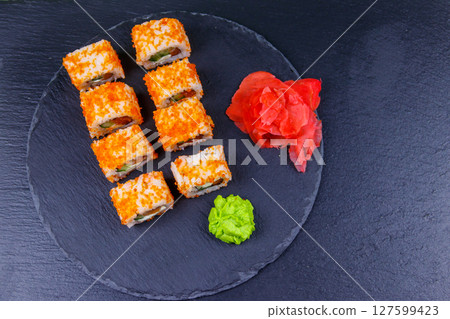 Sushi rolls Philadelphia on a black slate. Top view 127599423