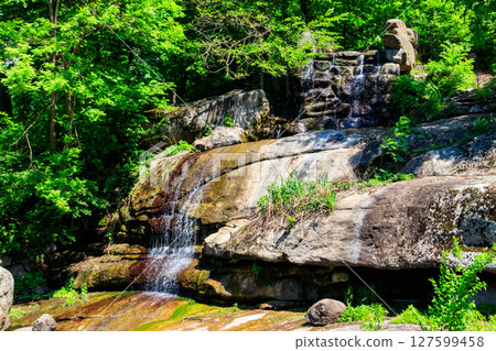 Beautiful waterfall in Sofiyivka park in Uman, Ukraine Beautiful waterfall in Sofiyivka park in Uman, Ukraine 127599458