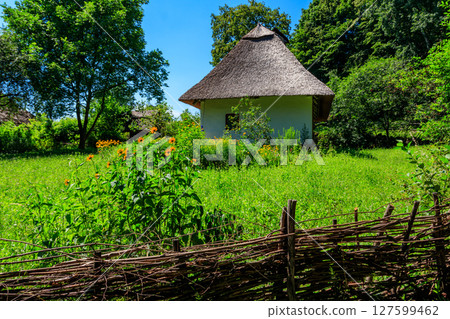Ancient traditional ukrainian rural house in Pyrohiv (Pirogovo) village near Kiev, Ukraine Ancient traditional ukrainian rural house in Pyrohiv (Pirogovo) village near Kiev, Ukraine 127599462