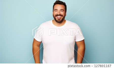 joyful young hispanic plus size body positive male man boy guy 30s in white blank design casual t-shirt posing color background studio portrait, ai 127601187