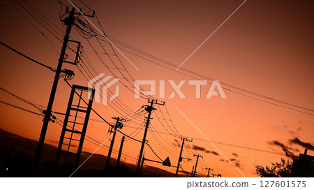 Sunset sky and power lines Sunset sky and power lines 127601575