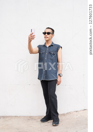 Full length portrait of nonbinary genderfluid young Asian gay man 127601733