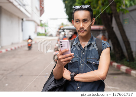 Nonbinary genderfluid young Thai gay man tourist in Thailand 127601737