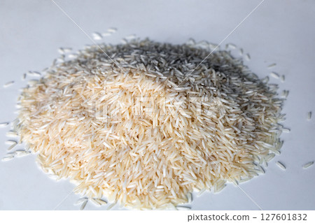 A pile of dry white rice 127601832