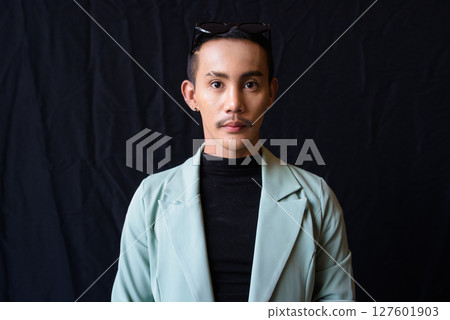 Portrait of nonbinary genderfluid young Asian gay man in studio 127601903