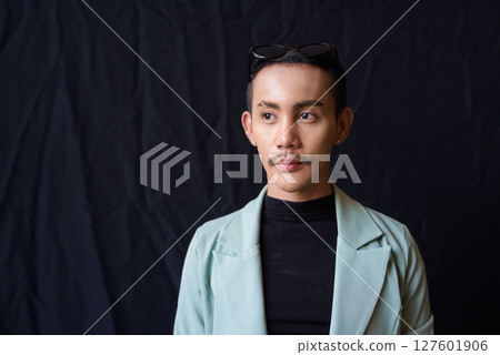 Portrait of nonbinary genderfluid young Asian gay man in studio Portrait of nonbinary genderfluid young Asian gay man in studio 127601906