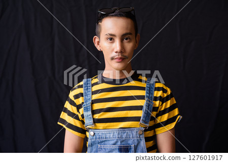 Studio shot of nonbinary genderfluid young Asian gay man 127601917