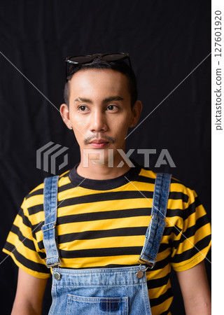Studio shot of nonbinary genderfluid young Asian gay man 127601920