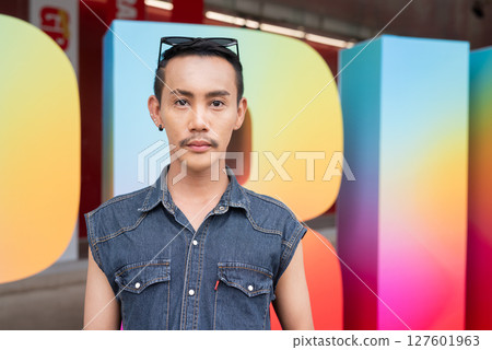 Portrait of confident non binary gay man during pride outdoors Portrait of confident non binary gay man during pride outdoors 127601963
