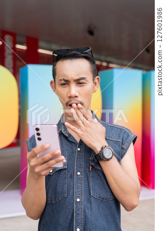 Portrait of confident non binary gay man during pride outdoors Portrait of confident non binary gay man during pride outdoors 127601986