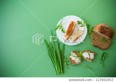 Sandwich with lard on rye bread and green onions on top 127602052