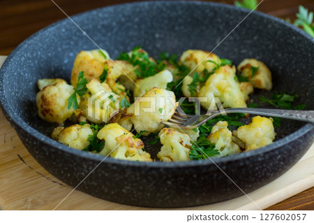 Top view of crispy cauliflower with parsley Top view of crispy cauliflower with parsley 127602057