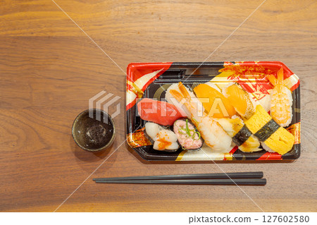 Dining alone: Sushi lined up on the table (right) 127602580