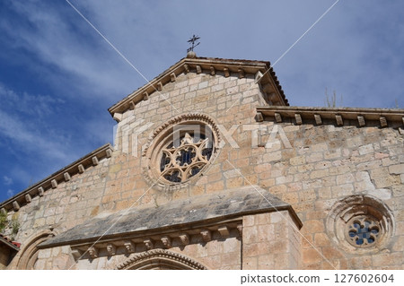 Historic romanesque church facade under blue sky in Brihuega Spain. Iglesia de San Felipe. Church Saint Felipe in Brihuega, Guadalajara, Spain 127602604