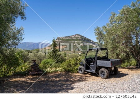 Explore a stunning scenic landscape featuring an ATV immersed in the beauty of nature 127603142