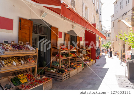Charming and vibrant street market bustling with fresh produce and lively community atmosphere 127603151