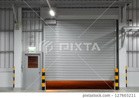 Shutter door in factory warehouse suit for industrial background. 127603211