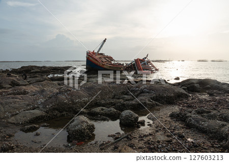 Old wrecked fishing boat on coast of Ang Sila Village, Saensuk Sub-district, Chonburi Province of thailand. Old wrecked fishing boat on coast of Ang Sila Village, Saensuk Sub-district, Chonburi Province of thailand. 127603213