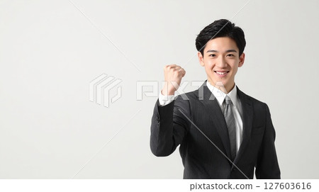  Businessman who plays guts pose 127603616
