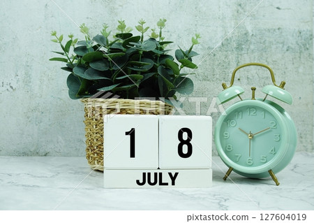 Wooden Calendar Showing the Date of July 18th. Day 18 of July month Wooden Calendar Showing the Date of July 18th. Day 18 of July month 127604019