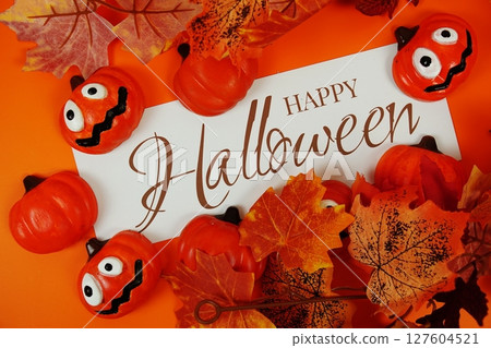 Happy Halloween text with element decorations on orange background 127604521