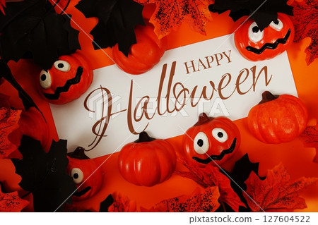 Happy Halloween text with element decorations on orange background 127604522