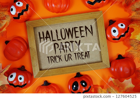 Halloween Party text with element decorations on orange background Halloween Party text with element decorations on orange background 127604525